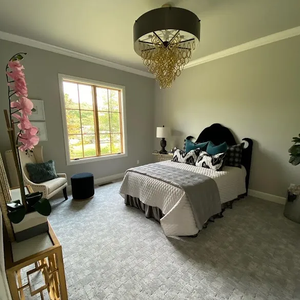 Freshly painted gray bedroom with white crown molding